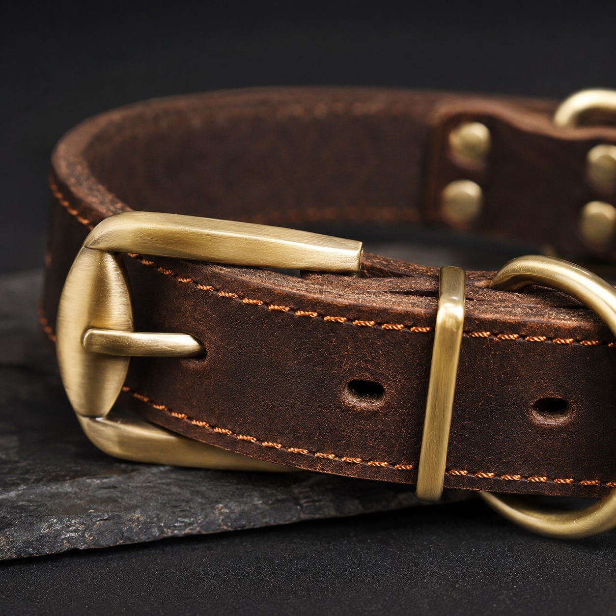 Close-up of Antique Gold Buckle and D-ring on Vintage Brown Leather Dog Collar